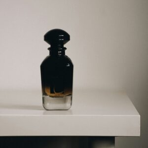 Oud perfume bottle on a white table