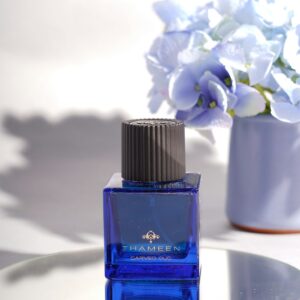 Oud perfume bottle on a glass table